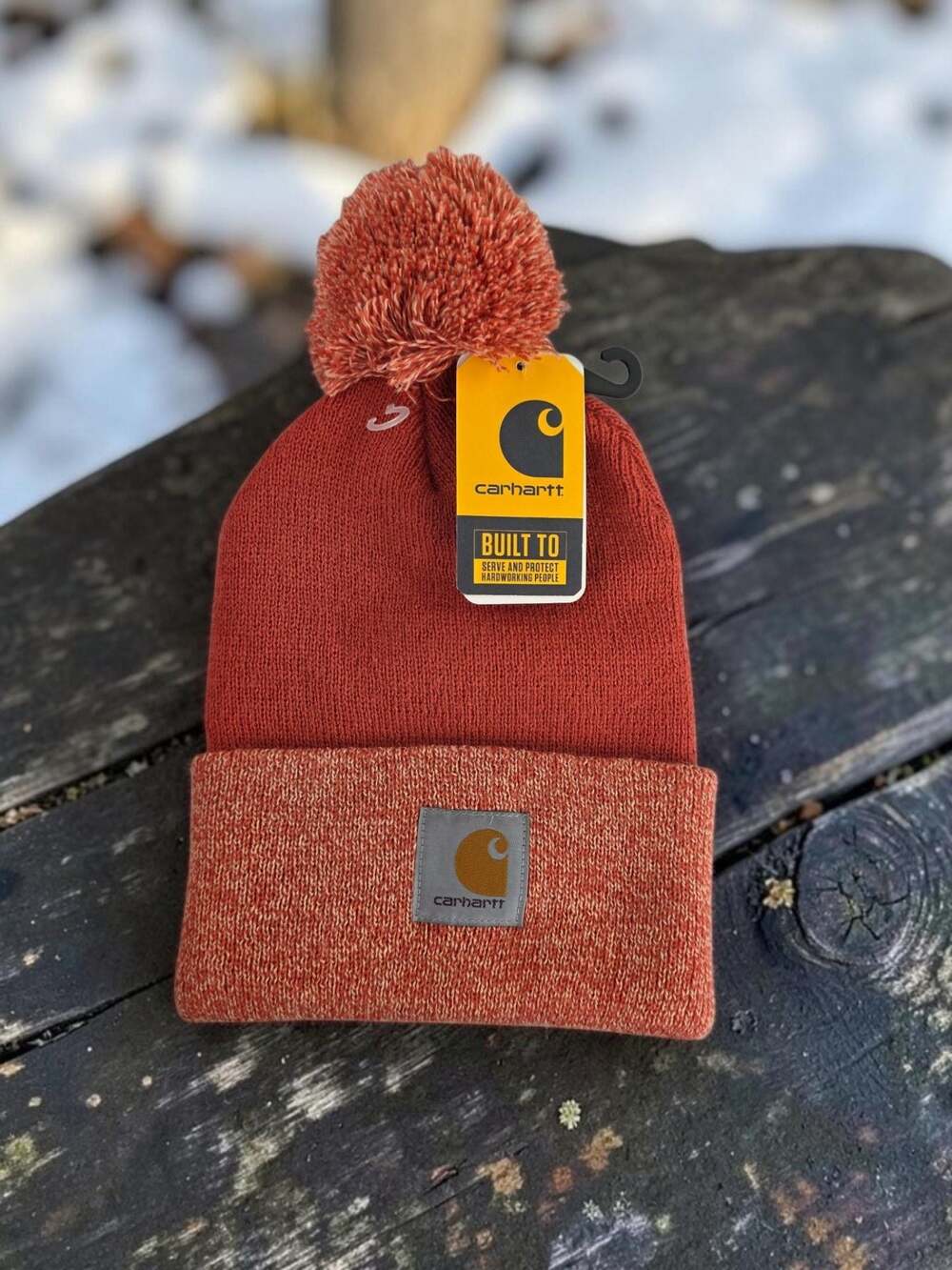 Carhartt Women's Lookout Pom Cuffed Knit Beanie Hat in Rust Orange